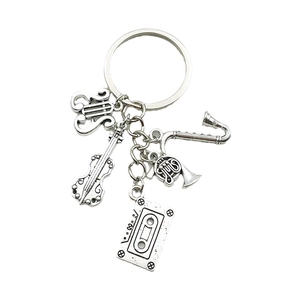 Antique silver musical instrument keychain with violin, saxophone and vintage tape charm