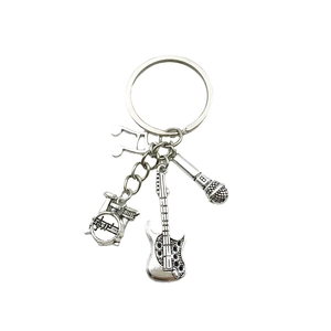 Antique silver music keychain featuring guitar, drum set, microphone and note charms