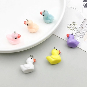 Colorful resin duck pendants in various shades for DIY jewelry making and crafts