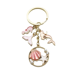 Golden mermaid and seahorse keychain with pink enamel charms and sea life pendants