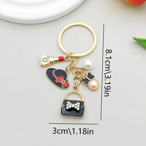 Porte-clés chic en alliage doré avec pendentifs chapeau noir, rouge à lèvres et perles
