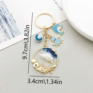 Portachiavi tema oceano blu con ciondoli delfino, polpo e conchiglia su anello oro