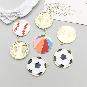 Close-up of assorted colorful enamel sports ball pendants with gold metal edges