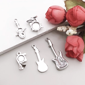 Antique silver musical instrument pendants set including guitar, violin, and drums for DIY