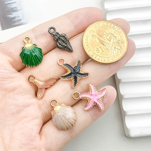 Set de dijes marinos de esmalte con conchas y estrellas de mar para crear bisutería
