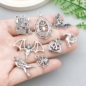 Set of 8 antique silver Halloween alloy charms featuring bats, pumpkins, and spider webs