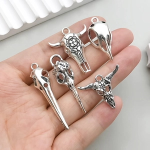 Set of 5 vintage silver alloy skull charms including bull and bird skulls for DIY jewelry