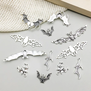 Set of 11 antique silver bat charms for DIY jewelry making featuring vintage alloy textures