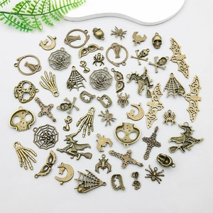 Macro shot of assorted Halloween bronze alloy pendants featuring skulls and witches