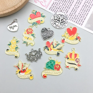 Detailed flat lay of colorful enamel Mother's Day charms with heart and flower shapes