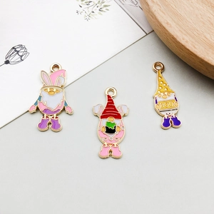 Detailed view of three colorful enamel gnome charms for DIY jewelry making jewelry