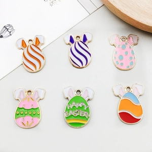 Macro detail of six colorful enamel Easter egg charms with rabbit ears for DIY jewelry