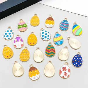 Detail of colorful Easter egg enamel charms with cartoon rabbit and chick patterns