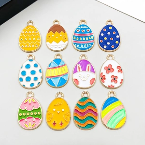 Detailed view of twelve colorful Easter egg enamel charms with floral and rabbit patterns