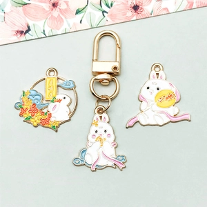 Detail of bunny enamel pendants with gold alloy lobster clasps for DIY jewelry making