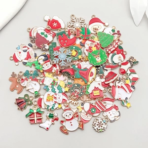 Detail of colorful enamel Christmas charms including Santa, reindeer, and snowflakes