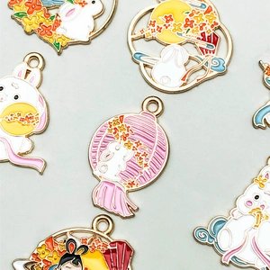 Detailed macro view of colorful enamel Mid-Autumn rabbit and lantern charm pendants