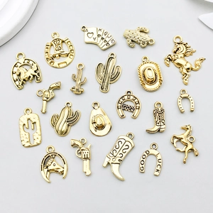 Macro view of vintage gold western cowboy alloy charms set with detailed engravings
