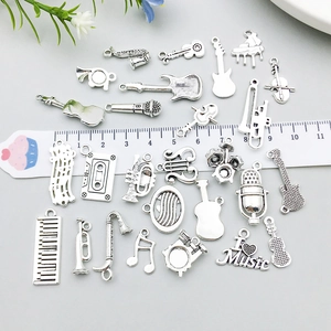 Antique silver music instrument charms collection for DIY jewelry making with ruler scale