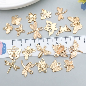 Golden insect charms for DIY jewelry making including butterflies bees and dragonflies
