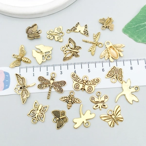 Antique gold insect pendants featuring butterfly, dragonfly and bee designs for DIY jewelry