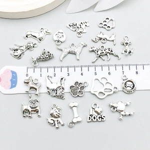 Antique silver dog charms set with bone and paw motifs for DIY jewelry making