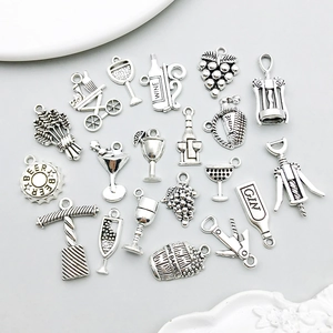 Macro view of vintage silver alloy wine and bar themed charms for DIY jewelry making