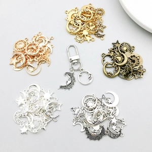 Detail of assorted celestial alloy pendants in five metallic finishes for DIY jewelry