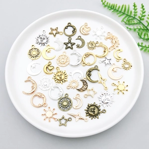 Assorted sun moon star alloy charms in multiple metallic colors for DIY jewelry making