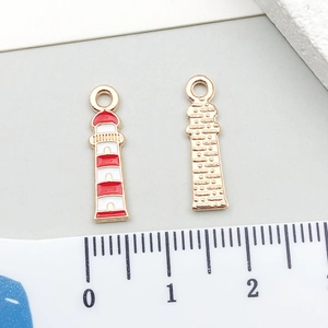 Detailed macro view of colorful lighthouse alloy pendant with red and white enamel finish
