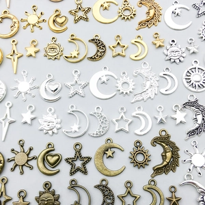 Assorted sun, moon, and star alloy pendants in gold, silver, and bronze for DIY jewelry