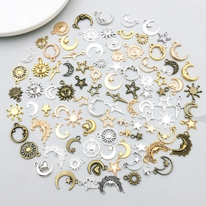 Assorted sun, moon, and star alloy charms for DIY jewelry making in multiple finishes