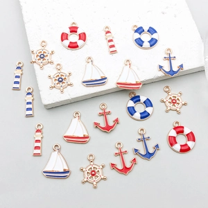 Assorted nautical enamel charms including anchors and rudders for DIY jewelry making