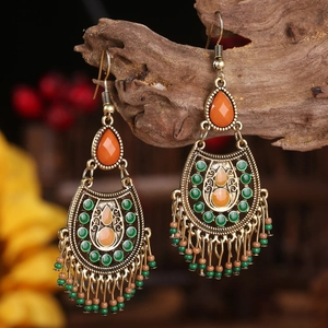 Bohemian dreamcatcher tassel earrings with orange stones and bronze metal details