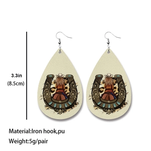 Detail view of large teardrop PU leather earrings with western motifs and leopard print