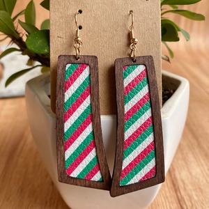 Detail view of Christmas earrings with striped leather inlay and dark wooden frames