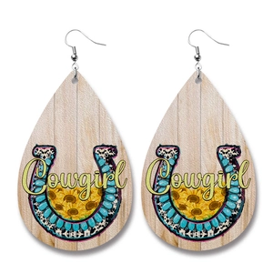 Detailed teardrop leather earrings with Cowgirl text and western sunflower motifs