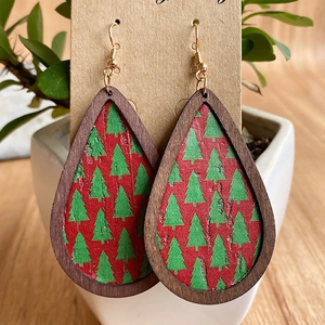 Christmas teardrop earrings with tree pattern in dark wood frames and red leather texture