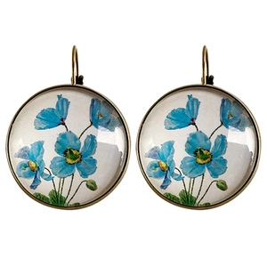 Pendientes vintage de bronce con motivo floral azul claro bajo cúpula de vidrio