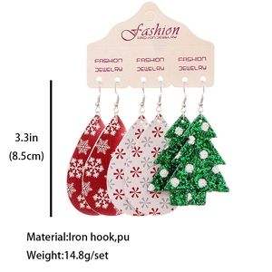Three pairs of Christmas themed teardrop and tree earrings in red, white and green PU leather