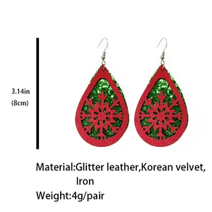 Detail of Christmas snowflake teardrop earrings made of glitter leather and velvet