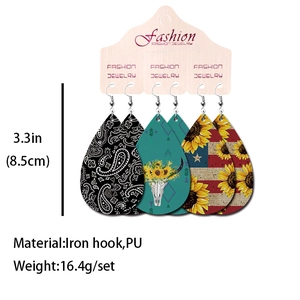 Set of Western faux leather earrings featuring cow skull, floral, and flag print patterns