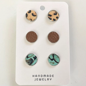 Three pairs of vintage leather earrings with leopard, brown, and turquoise patterns