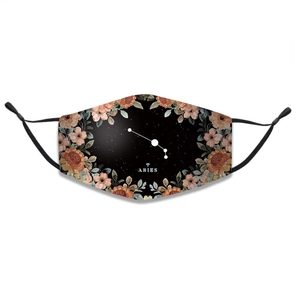 Detail of Aries zodiac printed cotton face mask with adjustable ear loops and floral border