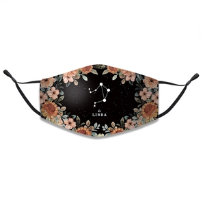 Detail of Libra zodiac cotton face mask featuring vintage floral print and adjustable ear loops