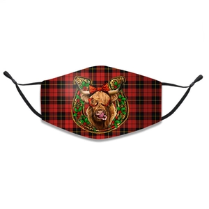 Detailed view of plaid Christmas face mask featuring a cute cartoon highland cow print