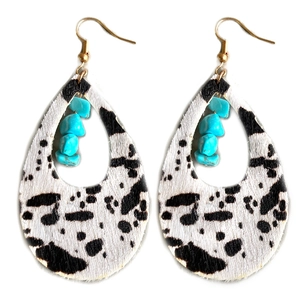 Bohemian cow print leather drop earrings with turquoise stones in a western style