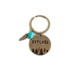 Western style turquoise keychain with silver feather pendant and engraved explore tag