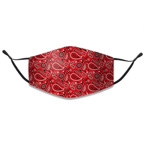 Detail of red paisley cotton face mask with adjustable black ear loops and soft texture