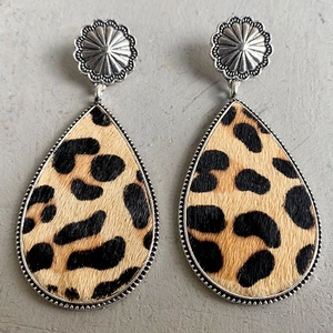 Detail of leopard print teardrop earrings with silver metal flower studs and beaded edges